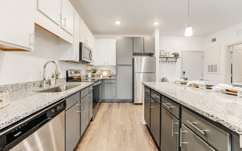 a kitchen with white cabinets