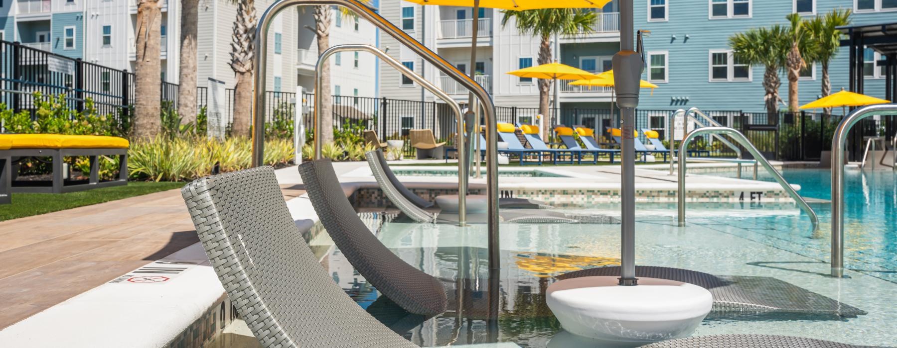 a pool with a yellow umbrella