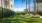 a backyard with corn hole and trees